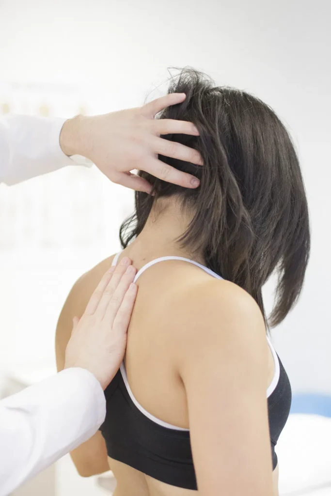 Neck pain being assessed by our enfield physiotherapist